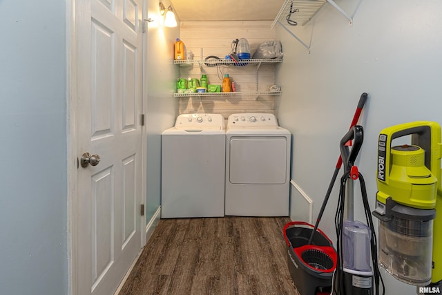 laundry room with washer and clothes dryer and dark hardwood / wood-style floors