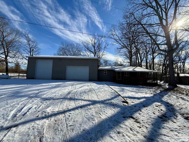 view of snow covered garage