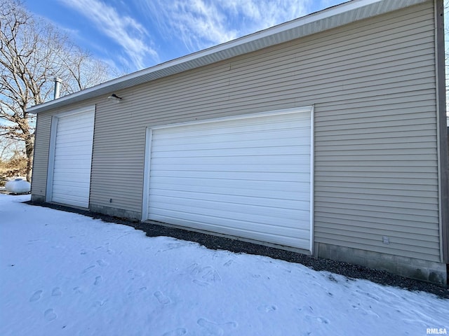 view of snow covered garage