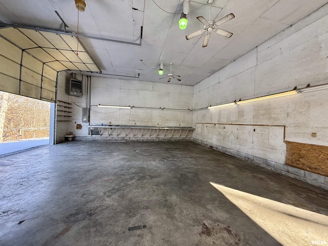 garage with ceiling fan, heating unit, and electric panel