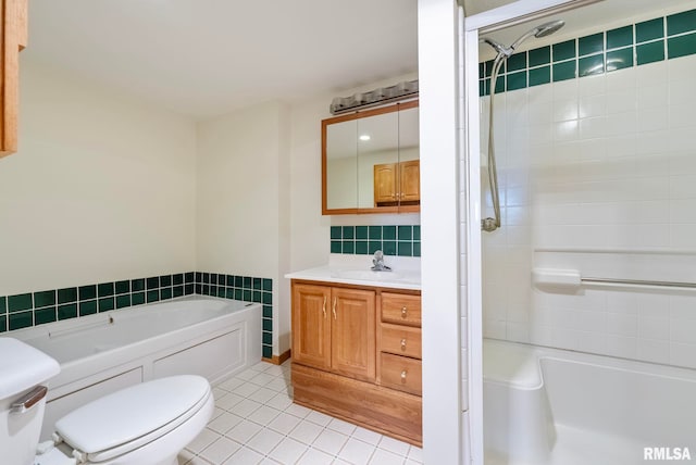 full bathroom with tile patterned flooring, vanity, backsplash, toilet, and independent shower and bath