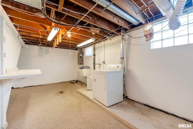 basement featuring a healthy amount of sunlight and washer / clothes dryer