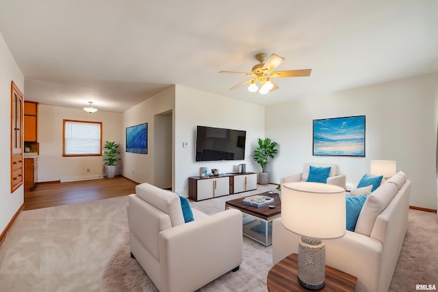 living room with ceiling fan and light carpet