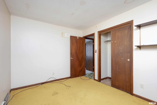 unfurnished bedroom featuring a closet and light carpet