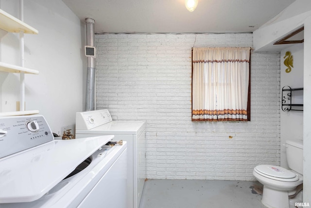 laundry area with washing machine and clothes dryer