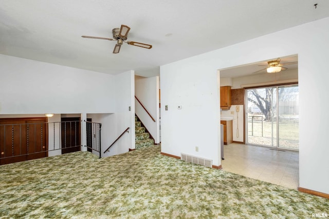 interior space with ceiling fan