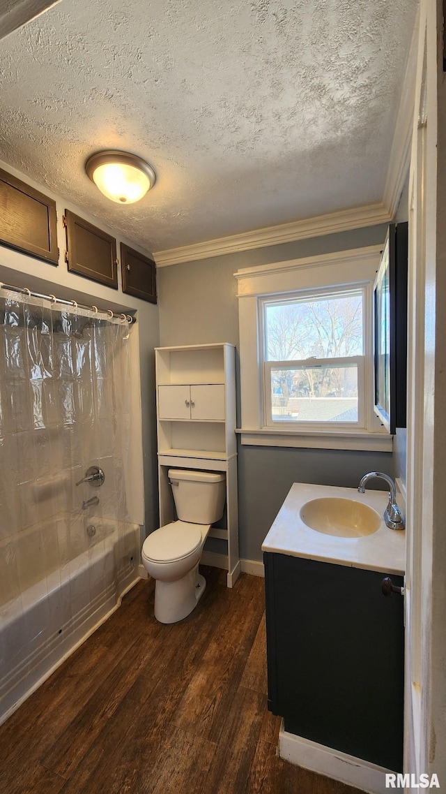 full bathroom featuring vanity, toilet, ornamental molding, hardwood / wood-style flooring, and bathtub / shower combination