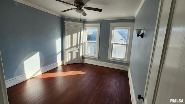 unfurnished room with ceiling fan, dark hardwood / wood-style floors, and ornamental molding