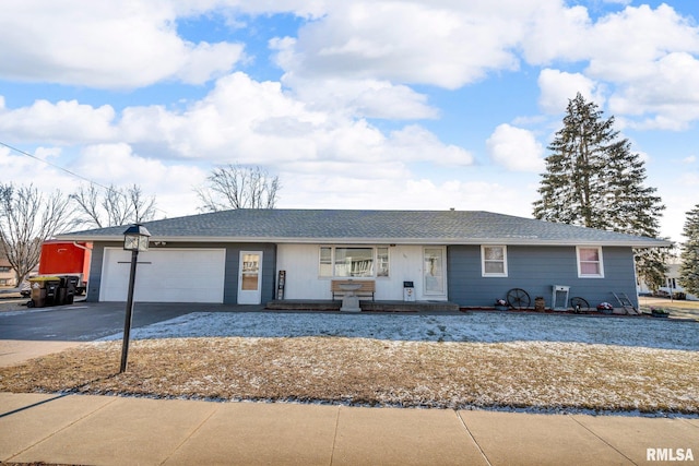 single story home featuring a garage and covered porch