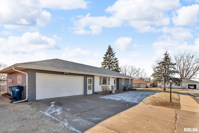 ranch-style house featuring a garage