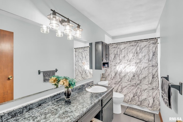 bathroom featuring toilet and vanity