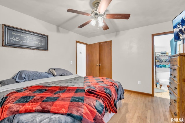 bedroom with ceiling fan, connected bathroom, and light hardwood / wood-style floors