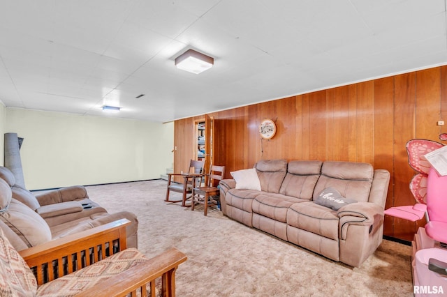 carpeted living room with wooden walls