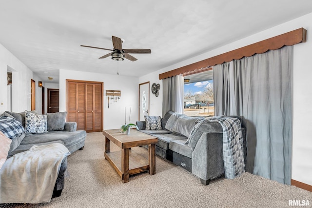 carpeted living room featuring ceiling fan