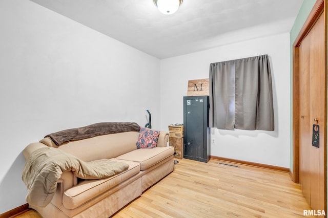 living room with light hardwood / wood-style flooring