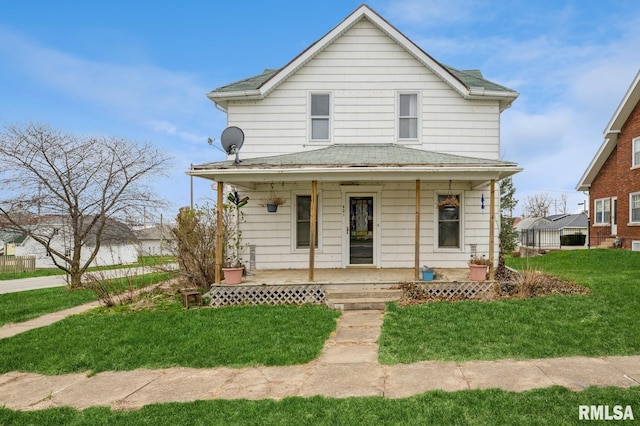 401 Jefferson Ave, Lowden, IA 52255 - view of front of home with covered porch and a front yard