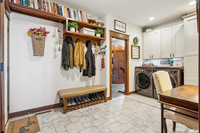 mudroom with washing machine and clothes dryer