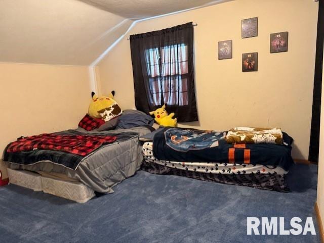 carpeted bedroom with lofted ceiling