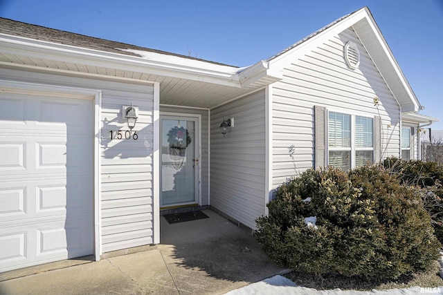 doorway to property featuring a garage