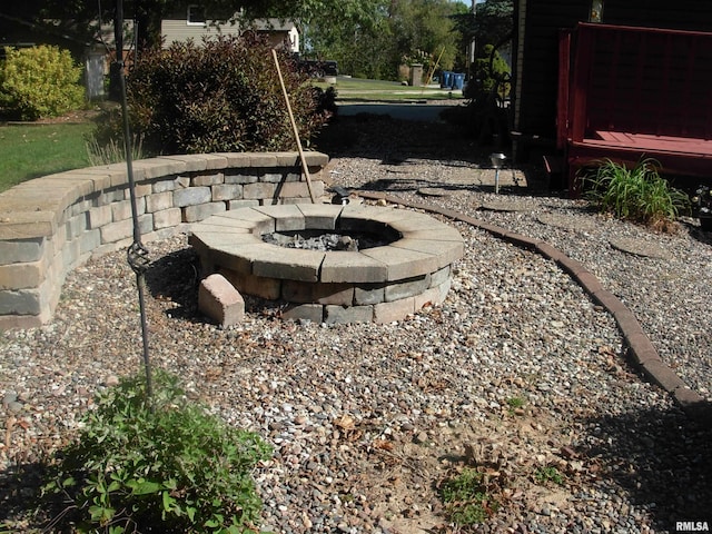 view of yard with an outdoor fire pit