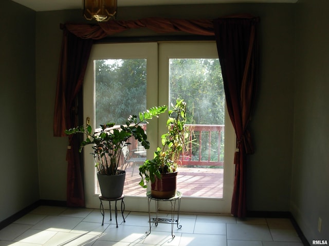 entryway with light tile patterned flooring