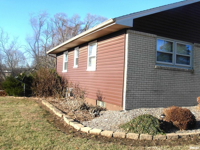 view of property exterior featuring a lawn