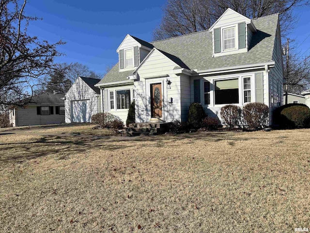 new england style home featuring a front yard