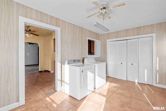 washroom with ceiling fan, light tile patterned floors, and separate washer and dryer