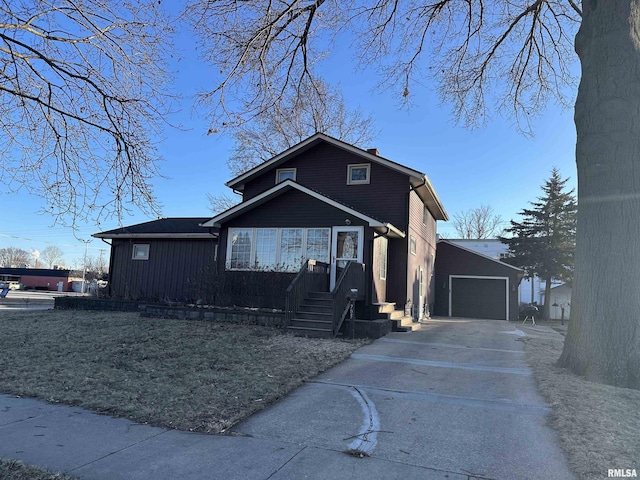 view of front of house featuring an outdoor structure and a garage