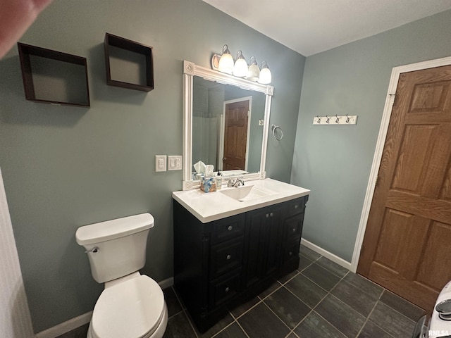 bathroom with tile patterned floors, toilet, and vanity