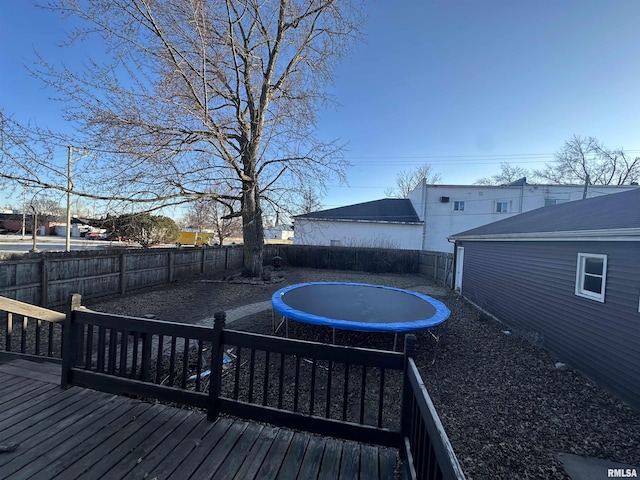 wooden deck with a trampoline