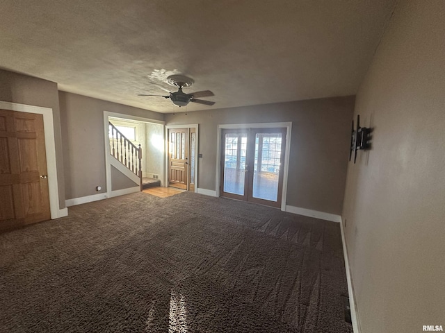 unfurnished living room featuring carpet and ceiling fan