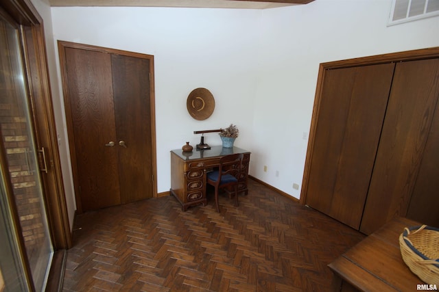 corridor with dark parquet flooring