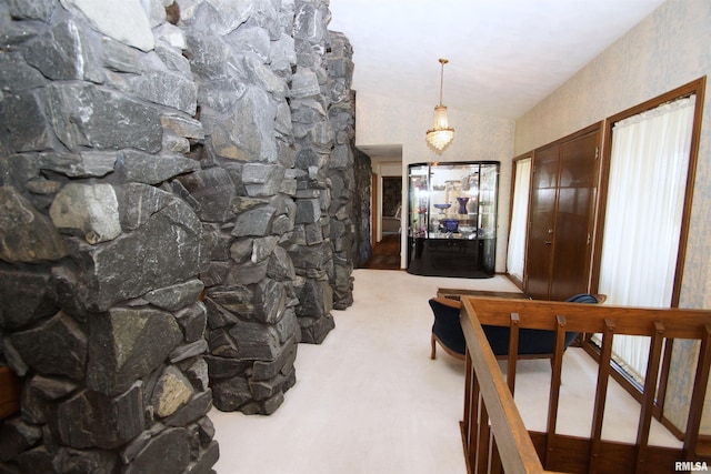 hallway featuring carpet floors