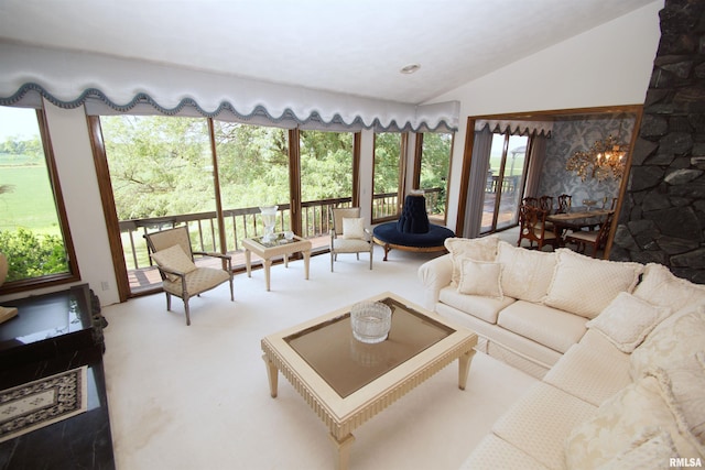 carpeted living room featuring lofted ceiling