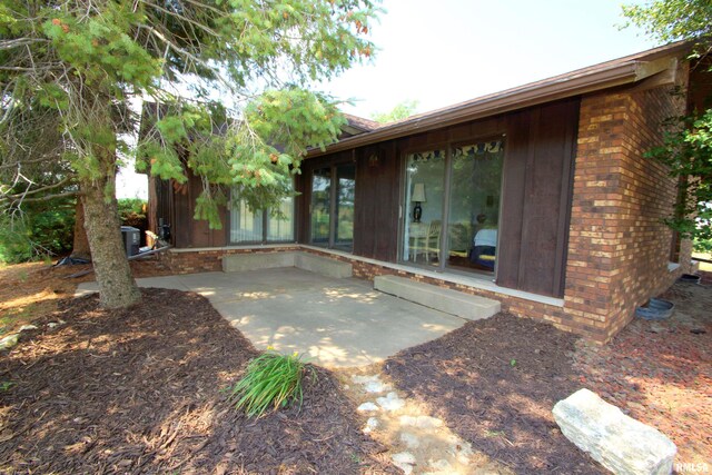 back of property with a patio