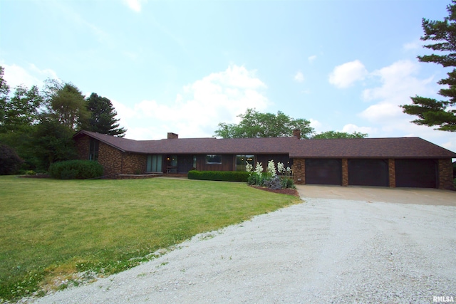 single story home featuring a front yard and a garage