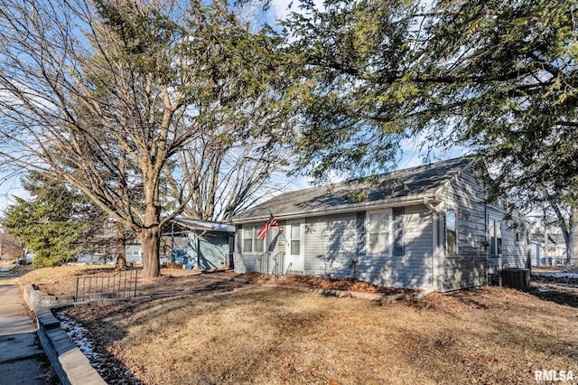 single story home featuring central AC and a front lawn