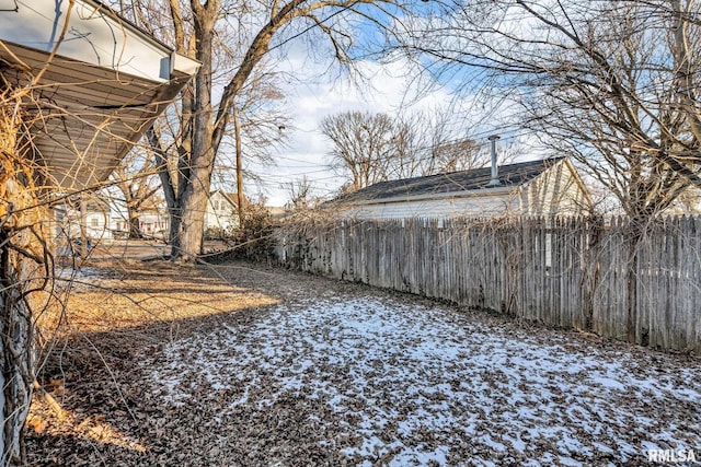 view of yard covered in snow