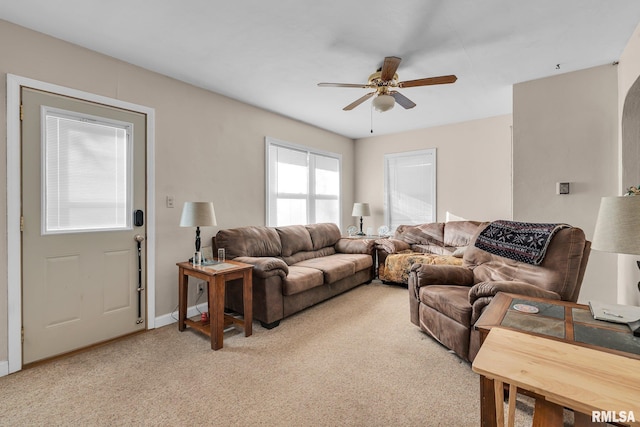 living room featuring ceiling fan and light colored carpet