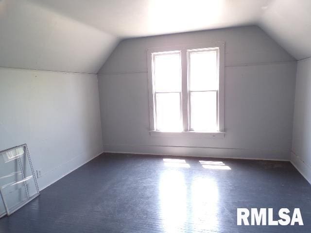 bonus room featuring lofted ceiling