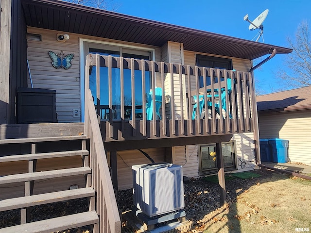 entrance to property featuring central AC unit and a balcony