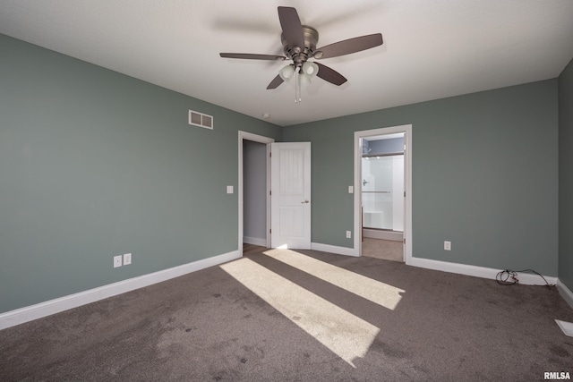 unfurnished bedroom with ensuite bath, ceiling fan, and carpet