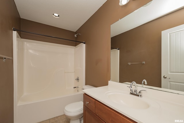 full bathroom with tile patterned floors, toilet, shower / bathing tub combination, and vanity