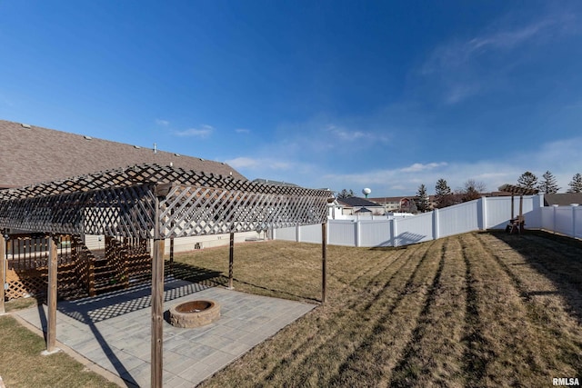 view of yard featuring a fire pit and a patio area