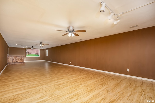 unfurnished room with light hardwood / wood-style flooring and ceiling fan