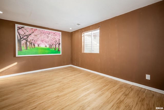 unfurnished room featuring light wood-type flooring