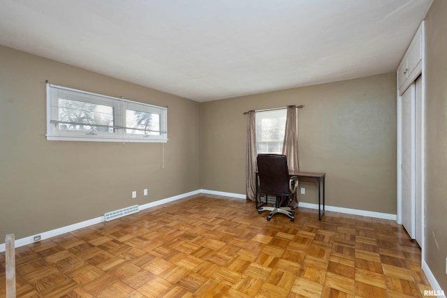 unfurnished office with light parquet floors