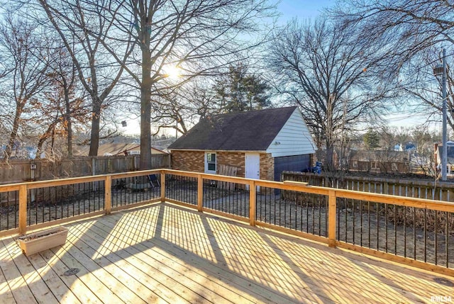 wooden terrace featuring an outdoor structure