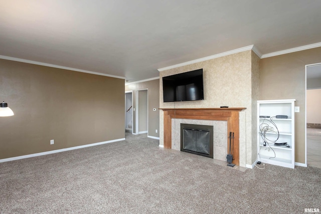 unfurnished living room with ornamental molding, carpet flooring, and a tile fireplace